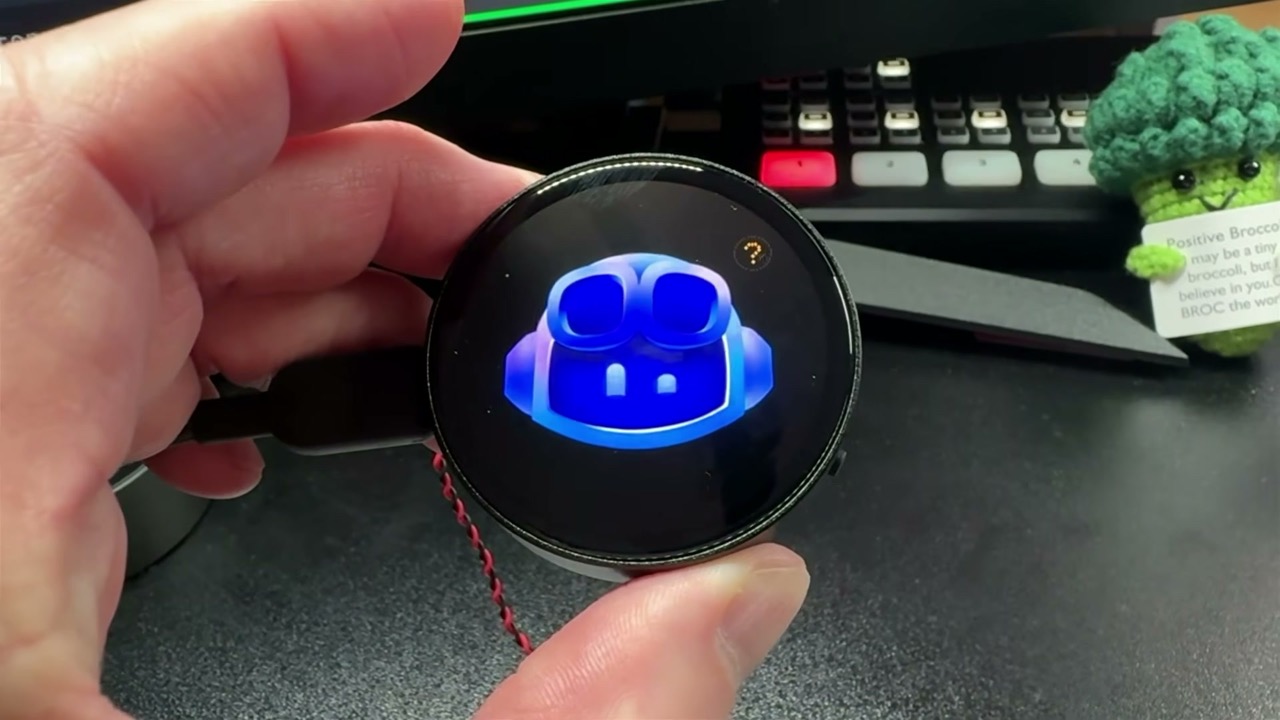 The physical Waveshare device running the Copilot character, held in my hand