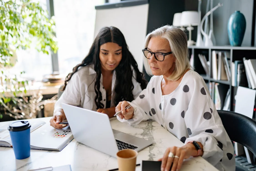 Two people collaborating together. This is much more challenging with employees (and customers) working remotely.